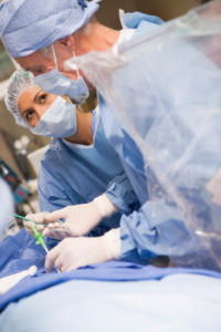 Surgeons Operating On Patient